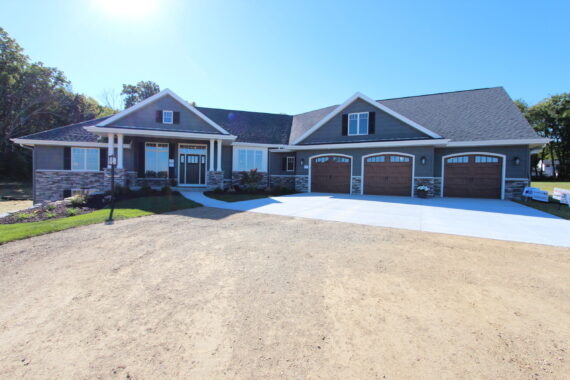 exterior-house Exterior view of a single story home with three car garage