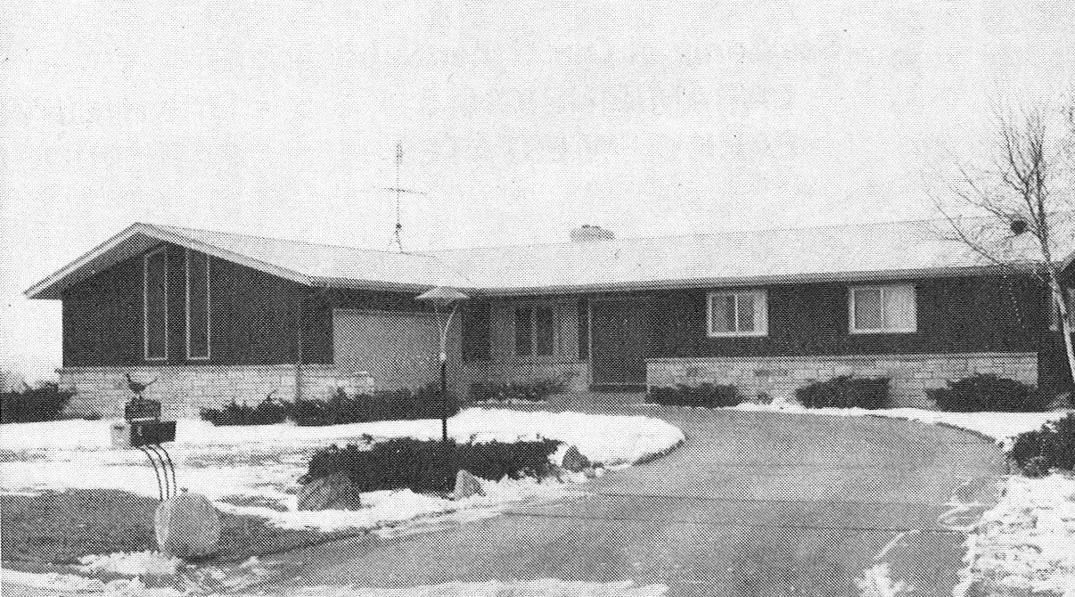 Home with a two car garage during the winter